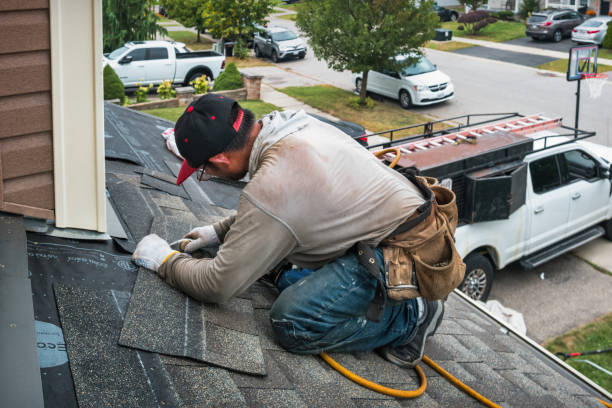 Professional Roofing technician working in White Cloud, MI